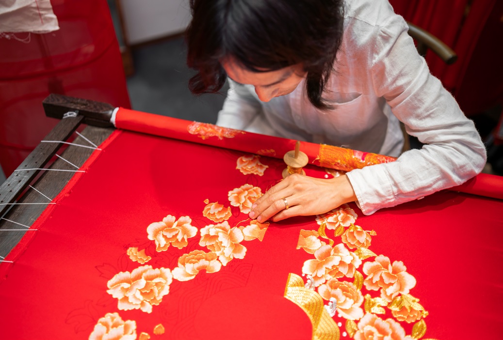 Woman embroidering